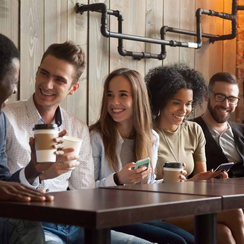  group of millennials in coffee shop 