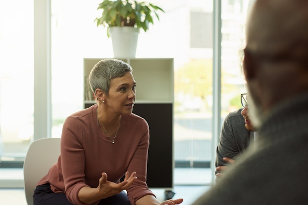  woman negotiating with others