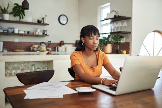  woman working from home on laptop