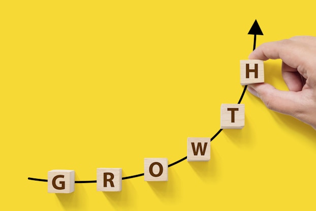  the word growth in block letters on yellow background