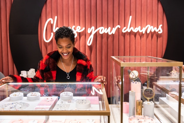  woman looking in pandora jewelry case