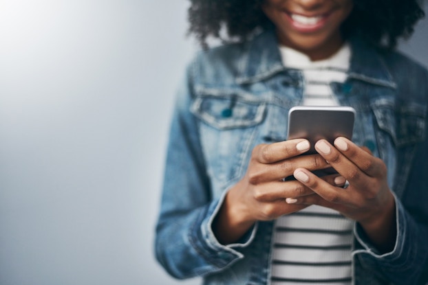 woman looking at smartphone