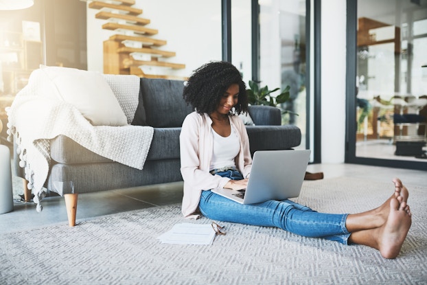 woman working remotely on laptop