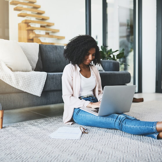 woman working remotely on laptop