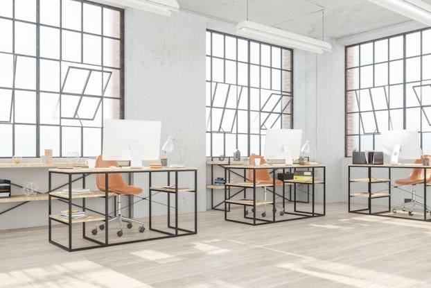 modern office with open windows and socially distanced desks