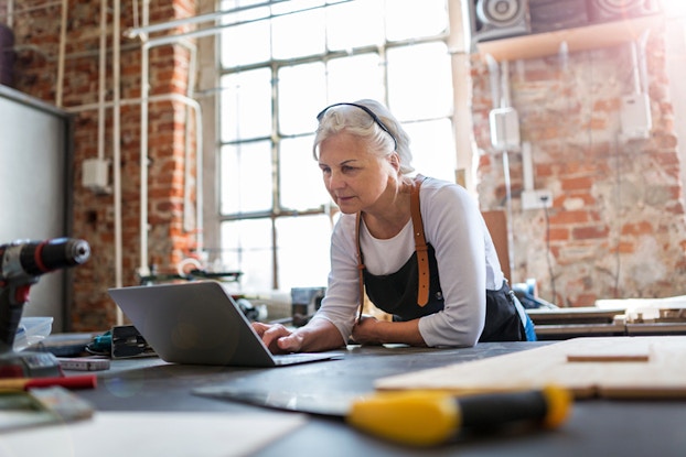  senior woman working on laptop