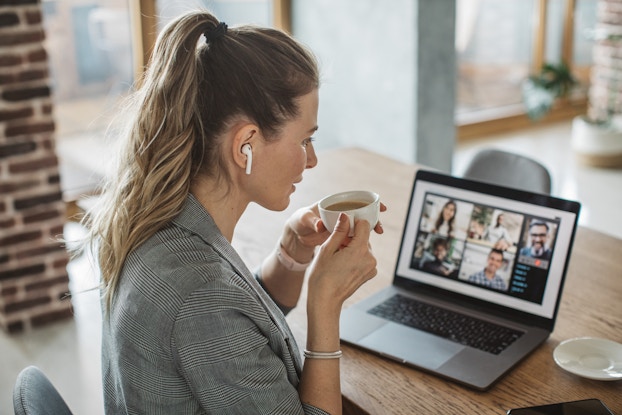  woman sitting at computer on a web conference