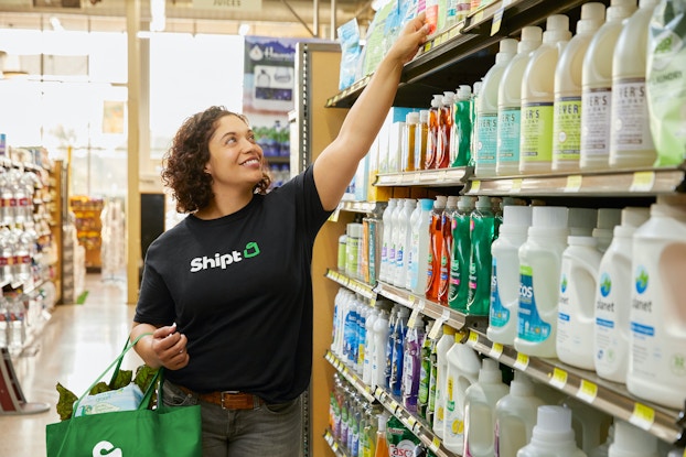  Shipt employee shopping in a grocery store.