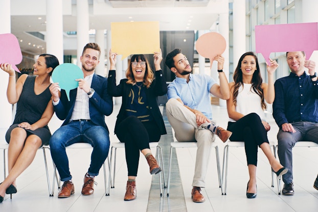  group of young professionals holding speech bubbles