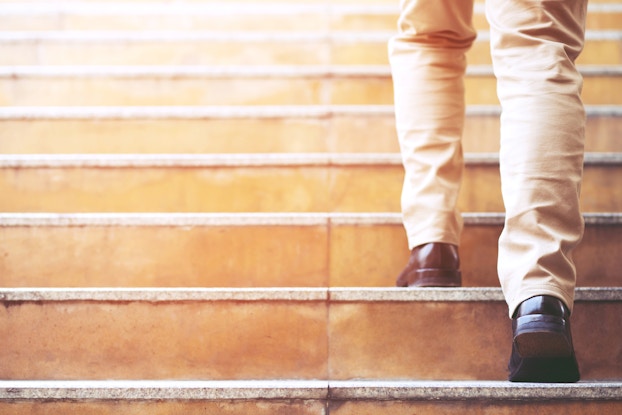 man walking up stairs