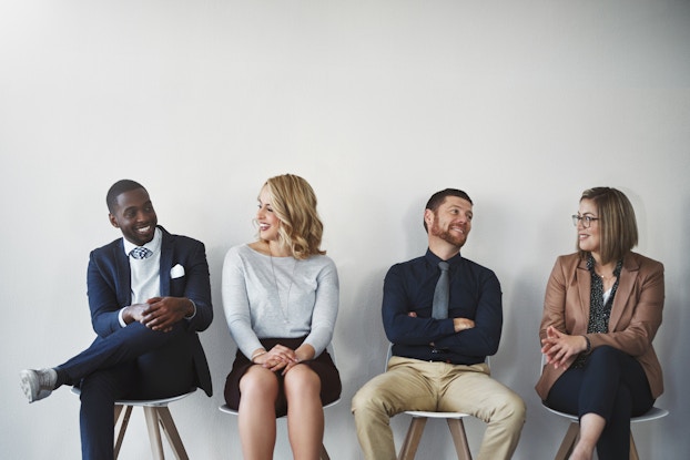 four candidates sitting waiting for job interview