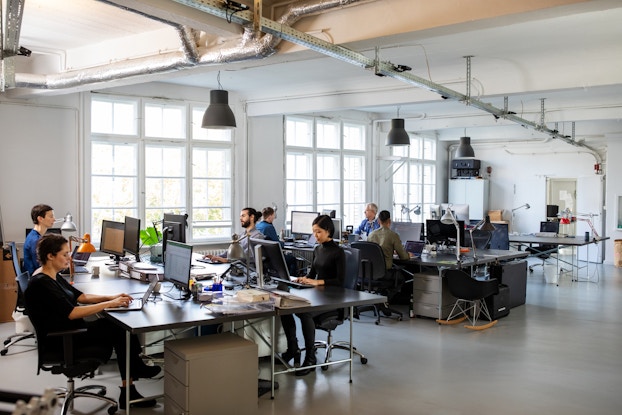  Busy modern open plan office with staff.