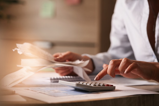 person doing tax calculations