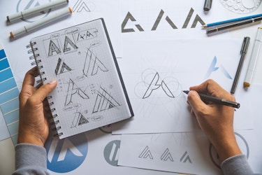  Overhead view of artist developing a logo design 