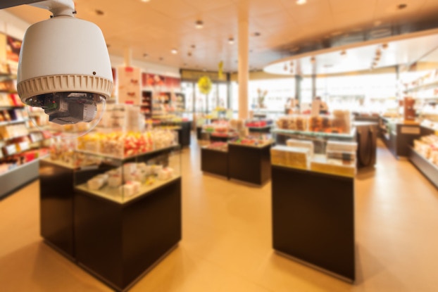  A closed-circuit video surveillance camera is installed in a shop corner to monitor the store at all times.