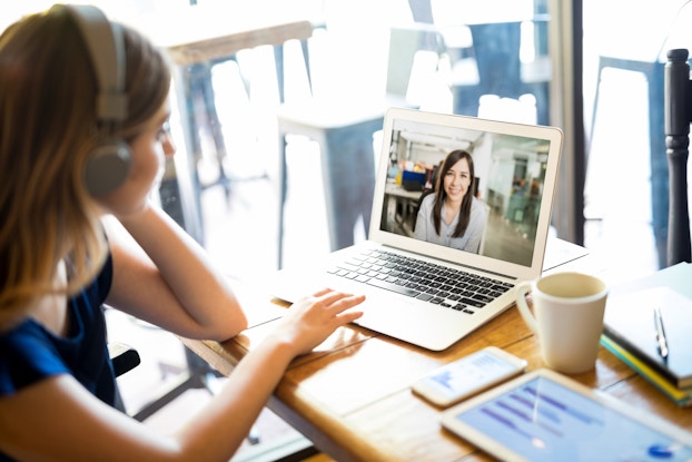  woman web conferencing on laptop