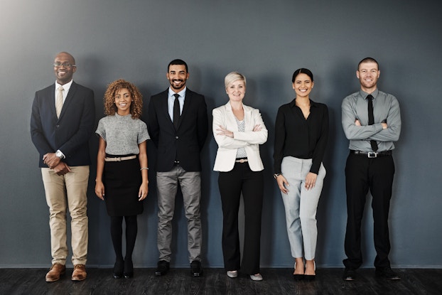 group of coworkers standing in a line