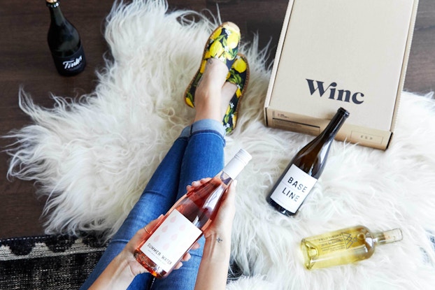  woman unboxing her winc wine box