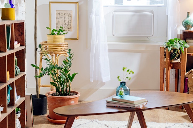 Air conditioning unit by Windmill in the window of a modern living room.
