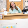 a woman sitting at a counter