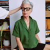 a woman sitting on a stool