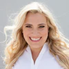 a woman with blonde hair smiling